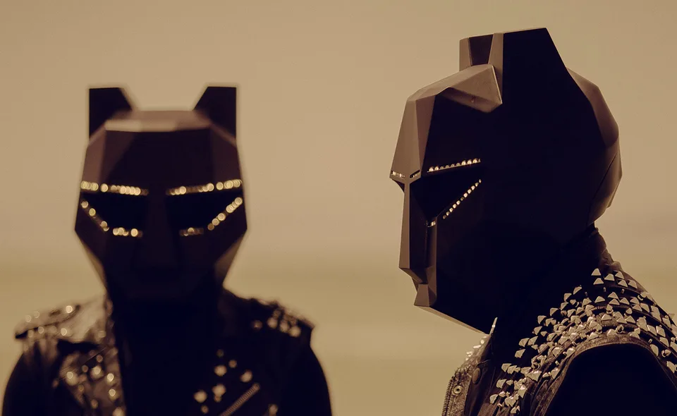 Black Tiger Sex Machine wearing angular black tiger helmets.